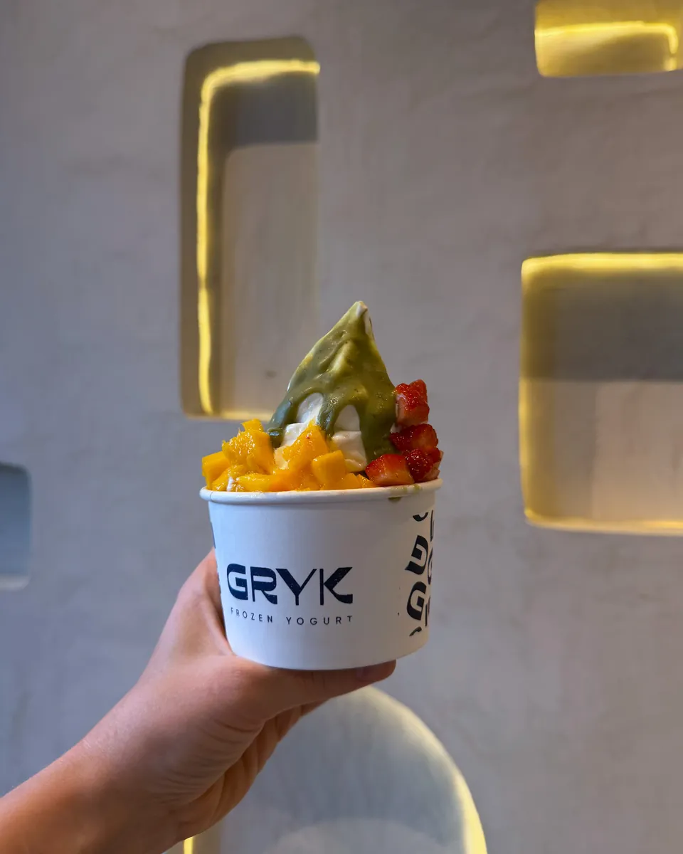 Un Gryk en la mano de un cliente