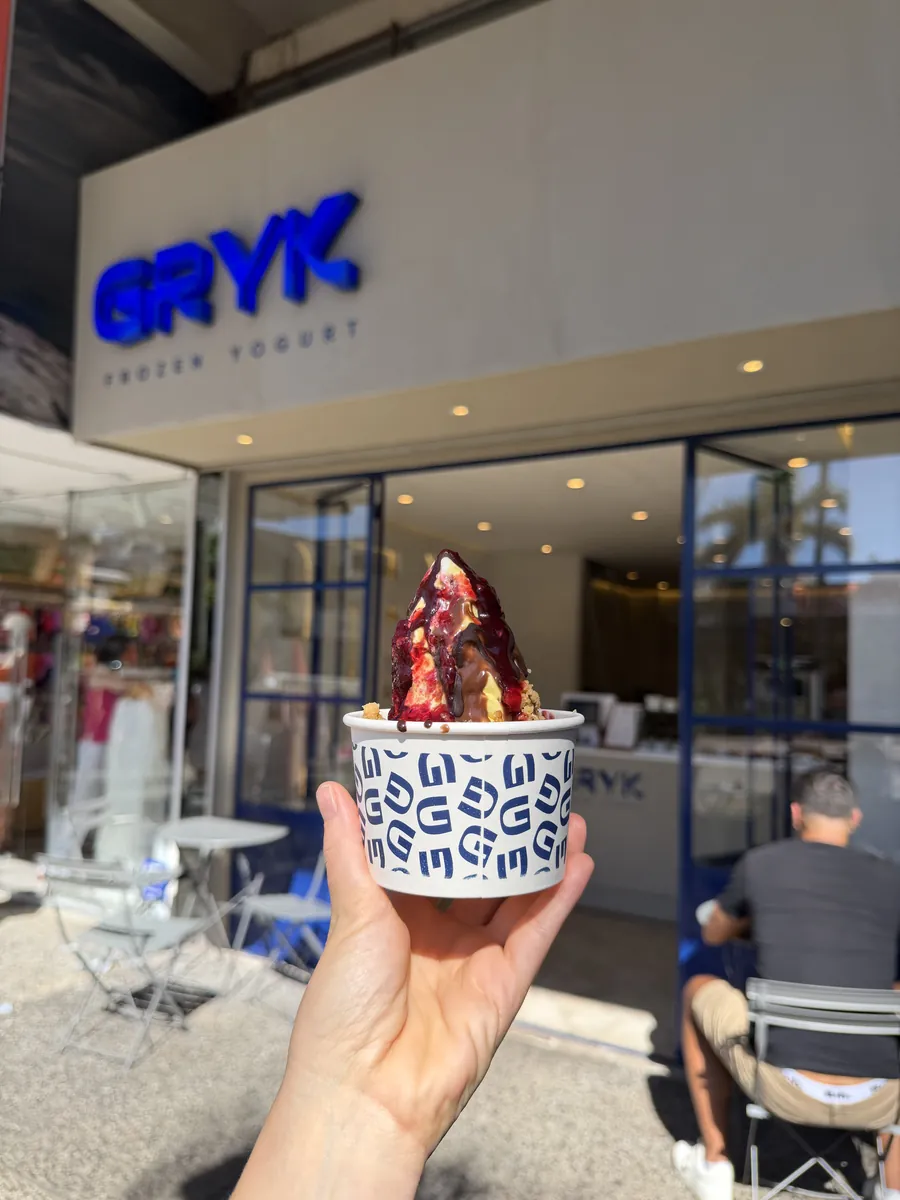 Un Gryk en la mano de un cliente