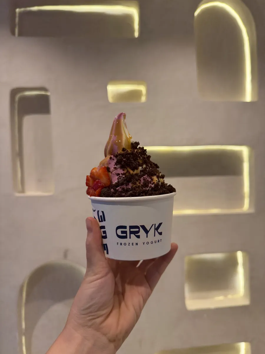 Un Gryk en la mano de un cliente